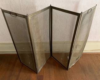 322 - Brass Fireplace Screen 30"x53" (Description): Brass fireplace screen featuring a four-panel folding design with mesh screens and carrying handles. Measures 30 inches by 53 inches.