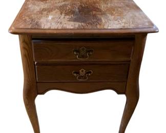 1138 - Queen Anne Stand 24"x19"x28" (Description): Wooden nightstand featuring two drawers with decorative brass bail pull hardware. The piece has cabriole legs with pad feet in a Queen Anne style. Measures 24 inches wide by 19 inches deep by 28 inches tall.
