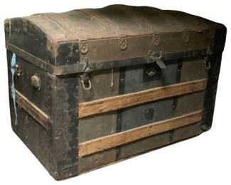 828 - Vintage Dome Top Trunk 20"x36"x18" (Description): Vintage trunk featuring a domed top with metal hardware and wooden slat reinforcements. The trunk has side handles and a front latch closure. Measures 20 inches by 36 inches by 18 inches.