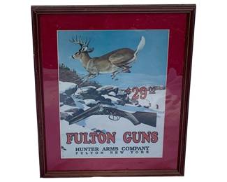 1073 - Framed Fulton Guns Print 21"x17" (Description): Framed Fulton Guns print featuring Hunter Arms Company of Fulton, New York. The print is presented in a wooden frame with red matting. Measures 21 inches by 17 inches.