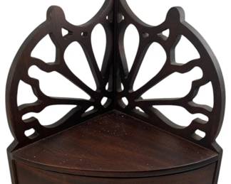 245 - Wood Corner Shelf with Drawer (Description): A wood corner shelf featuring decorative fretwork back design and a single drawer with brass knob pull. The piece is designed to fit into a corner space, offering both display surface and storage.