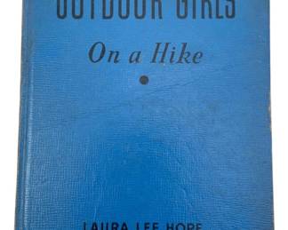 874 - Outdoor Girls on a Hike by Laura Lee Hope (Description): Outdoor Girls on a Hike by Laura Lee Hope. This vintage book features a blue textured hardcover binding. Part of the popular Outdoor Girls series written under the Stratemeyer Syndicate pseudonym Laura Lee Hope.