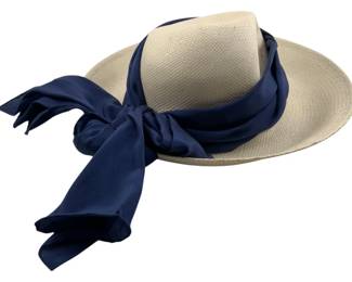 695 - Cappelli Hat (Description): A Cappelli hat featuring a classic design suitable for warm weather wear.