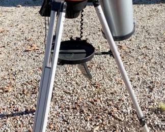 1015 - Nexstar Telescope 44"x24" (Description): Nexstar telescope mounted on an adjustable tripod stand. Measures 44 inches by 24 inches. Used as-is electric/electronic/mechanical item. No guarantee all components present, untested if not otherwise stated.