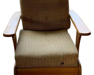 1027 - Vintage Rocker (AS-IS) 33"x25"x31" (Description): Vintage rocking chair sold as-is. Features a wooden frame with curved armrests and upholstered seat and back cushions in a neutral woven fabric. Measures 33 inches high by 25 inches wide by 31 inches deep.