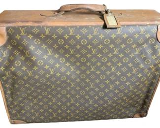 835 - Vintage Louis Vuitton Suitcase (Description): Louis Vuitton suitcase featuring the classic monogram pattern with leather trim. This piece shows signs of wear and damage, with a stuck zipper. Measures 20 inches by 24 inches by 9 inches.