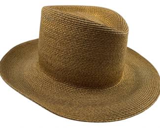 697 - Saks Fifth Avenue Hat (Description): A Saks Fifth Avenue hat featuring classic styling. This hat bears the prestigious Saks Fifth Avenue label, indicating quality craftsmanship and refined design.