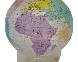 1127 - Plastic Globe 14"x11" (Description): Plastic globe featuring a colorful map of the world with labeled countries and bodies of water. The globe sits on a clear plastic stand. Measures 14 inches by 11 inches.