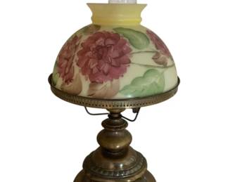 727 - Antique Lamp w/ Cut Cord 21" (Description): Features a decorative metal base with ornate footed design and a hand-painted glass shade with floral motif. Includes glass chimney.