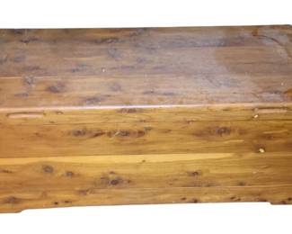 1139 - Wood Cedar Trunk 16"x42"x19" (Description): A wood and cedar trunk featuring a hinged lid and cut-out handles on the sides. The chest measures 16 inches high by 42 inches wide by 19 inches deep.