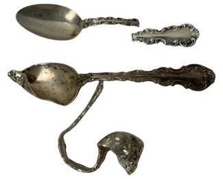 2033 - Group Lot of 3 Damaged Sterling Spoons 81.9g (Description): Group lot of three damaged sterling silver spoons. The spoons feature ornate handles with decorative scrollwork patterns. One spoon has been bent into a curved or twisted configuration.