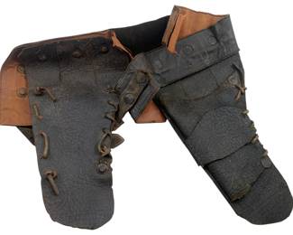 807 - Leather Gun Holster 10"x14" (Description): Leather gun holster featuring black exterior leather with tan interior lining. The holster features lace-up detailing and metal rivets. Measures 10 inches by 14 inches.