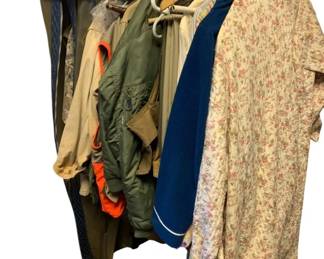 676 - Group Lot of Womens Hunting Clothes (Description): A group lot of women's hunting clothes. This collection includes various pieces suitable for outdoor and hunting activities.