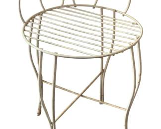 734 - White Metal Vanity Stool 22"x14" (Description): White metal vanity stool featuring an open wirework design with decorative looped back. Measures 22 inches by 14 inches.