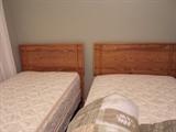 pair of twin beds, clean mattresses
