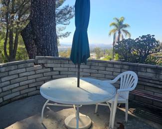 Patio table with umbrella and 3 chairs 45.00