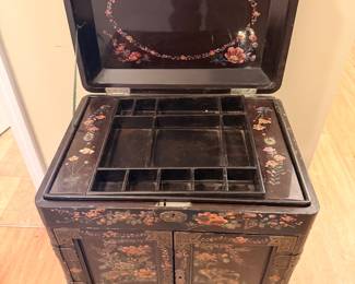 Asian Black Lacquer Jewelry Cabinet – Beautiful black lacquer cabinet with hand-painted floral and bird designs, multiple drawers, and curved legs.