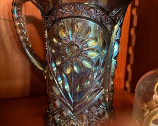Vintage Carnival Glass Pitcher – Iridescent decorative glass pitcher featuring raised floral designs.