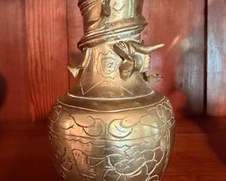 Engraved Brass Decorative Vase – Beautiful brass-tone vase featuring floral engraving.