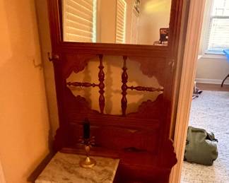 Ornate Victorian-Style Hall Tree – Beautiful carved wooden entryway hall tree with mirror, marble-top surface, and umbrella storage.