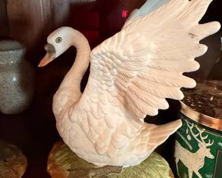 Pair of Decorative Swan Figurines – Matching white swans with raised wings.