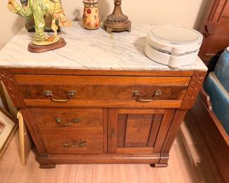 Antique Marble-Top Washstand – Beautiful wooden washstand featuring marble surface, storage drawers, and cabinet.