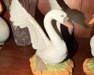 Pair of Decorative Swan Figurines – Matching white swans with raised wings.