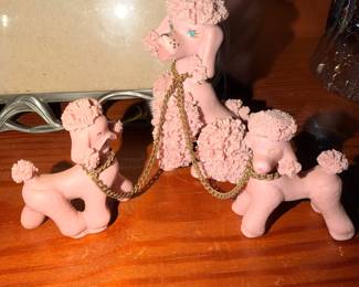 Vintage Pink Spaghetti Poodle Figurines – Charming pink ceramic poodle figures with decorative gold-tone chains.