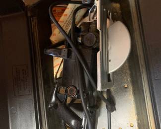 Vintage Sears Craftsman worm drive circular saw, stored inside its original black molded plastic carrying case alongside original paperwork.