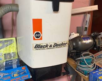 Vintage Black & Decker central vacuum power unit mounted on a wall, showing light wear.