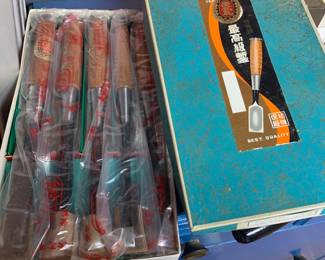 Boxed set of Japanese wood carving chisels, individually wrapped in plastic inside their original patterned presentation box.