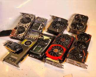 Lot 124: Lot of Mixed GPU's including (1) EVGA GeForce GTX 1080 Ti Graphics Card, (1) Gigabyte GeForce GTX 1080 Graphics Card, (1) NVIDIA Quadro P4000 Graphics Card, (1) Zotac GeForce GTX 1060 Graphics Card, (1) MSI GeForce GTX 980 Ti Graphics Card, (1) MSI M.2 Xpander-Aero Gen4 Expansion Card, (1) DVS Atomix LT 2.0 Capture Card