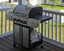 Gas Grill (less than 1 year old) with propane tank