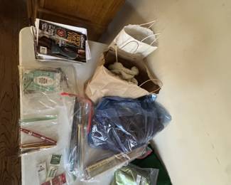 knitting and crochet tools, including yarn.