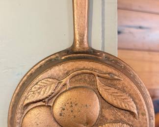 vintage decorative wall-hanging pan featuring a 3D embossed fruit design with a copper-colored finish