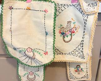 vintage, hand-embroidered linen or cotton textiles with decorative crocheted or lace edges