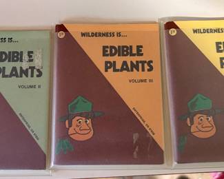 vintage pocket-sized survival and field guides titled Wilderness Is... Edible Plants (Volumes I, II, and III) by Ron Dawson and Dennis Bleything, published in the 1970s