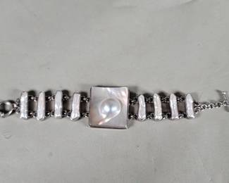 Lot 504 Vintage silver and Biwa pearl link bracelet with a central square pearl. scratch