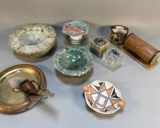 Lot 501h Group of vintage alabaster ashtrays, pipe and pipe rest, tabletop lighters, etc. Used as props in TV and movie productions