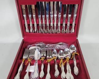 Lot 327 Oneida stainless steel 65 piece flatware in a wood case. case is