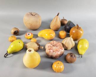 Lot 572 Group of wood and marble fruit decorations