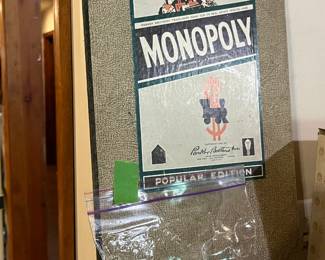 Monopoly game board and some pieces, c. 1954