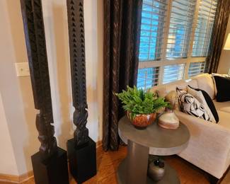 Carved totems sold by Ethan Allen
