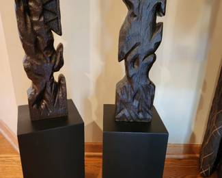 Carved totem style accessories sold byEthan Allen