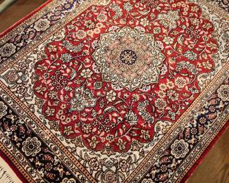 Beautiful tabletop size hand knotted rug