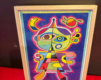 Lot 17: Framed colorful abstract art with back label