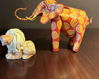 Lot 30: Hand carved animal figurines: painted elephant and carved lion