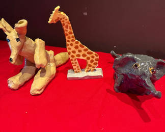 Lot 21: Handmade animal sculptures: giraffe and dogs