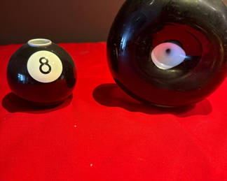 Lot 24: Black glass art vases with 8-ball and eye motifs