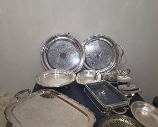 "Estate sale silver and silverplate trays, platters, bowls, and covered dishes— ideal for entertaining or vintage décor. Keywords: silver, silverplate, vintage, trays, platters, bowls, collectibles.